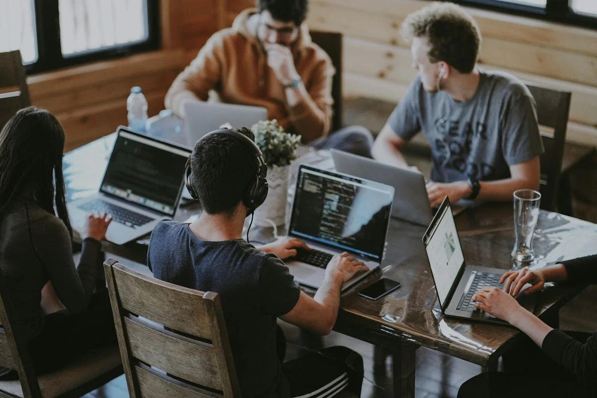 People working together and sharing ideas around a table